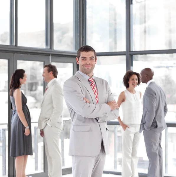 Portrait of a nice businessman with his team — Stock Photo, Image