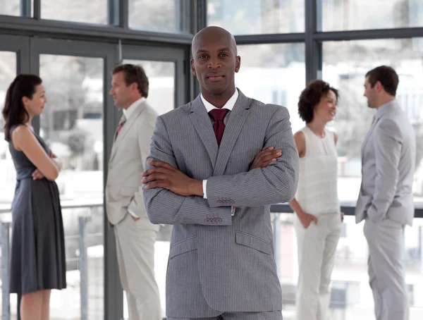 Portrait of a cheerful businessman with his team — Stock Photo, Image