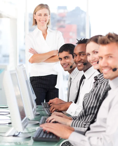Happy team in a call center — Stock Photo, Image