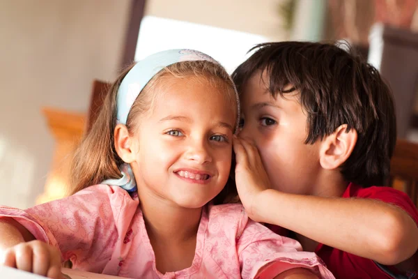 Cute boy talking to his sister — Stock Photo, Image