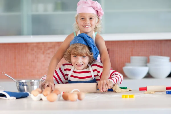 Lovely children baking at home — Stock Photo, Image