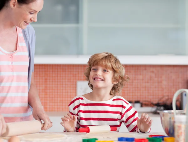 Nice mother and her son baking at home — Stock Photo, Image