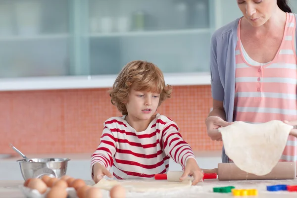 Nice mother and her son baking at home — Stock Photo, Image