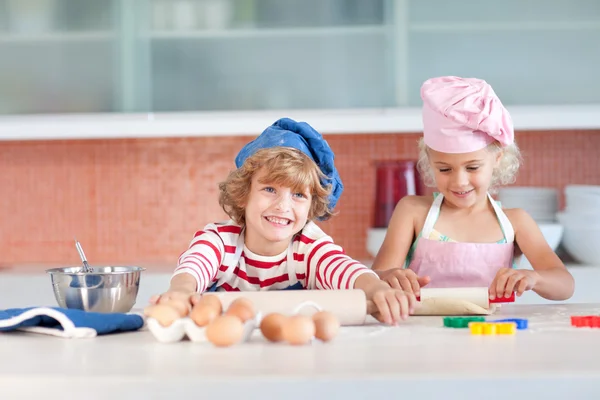 Nice children baking in a kitchen — Stock Photo, Image