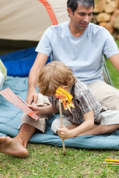 Father and son planting a flower — Stock Photo, Image