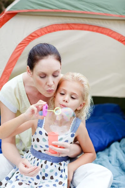 Mother and daughter together in tent — Stock Photo, Image