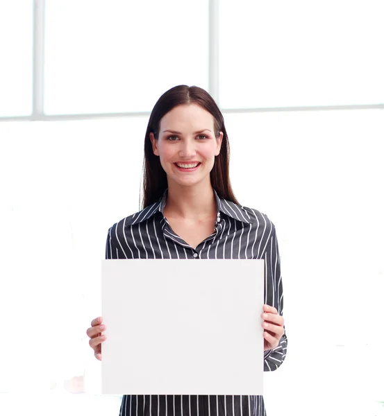 Smiling woman showing a big business card — Stock Photo, Image