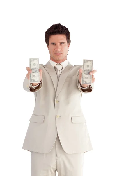 Hombre de negocios radiante mostrando dólares — Foto de Stock