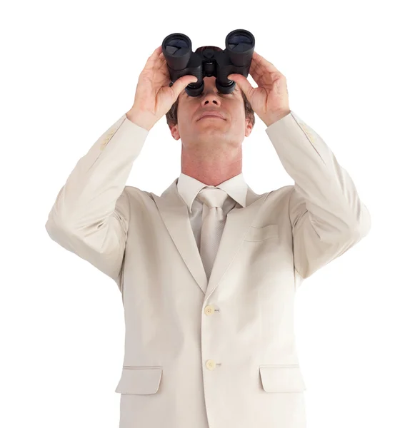 Confident businessman with binoculars — Stock Photo, Image