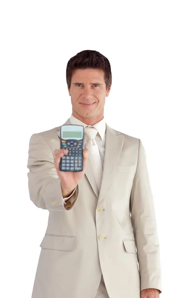 Hombre de negocios guapo sosteniendo una calculadora — Foto de Stock