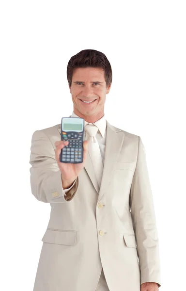 Hombre de negocios guapo sosteniendo una calculadora —  Fotos de Stock