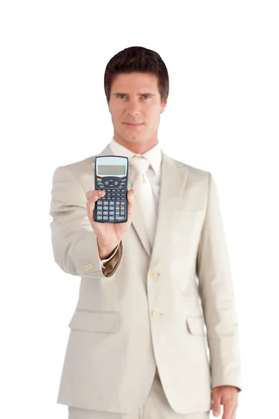 Bello uomo d'affari con in mano una calcolatrice — Foto Stock
