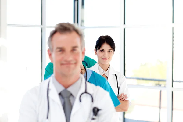 Confident young female doctor smiling at the camera — Stock Photo, Image