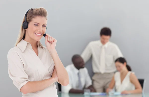Portrait of businesswoman standing with her collegues — Stock Photo, Image