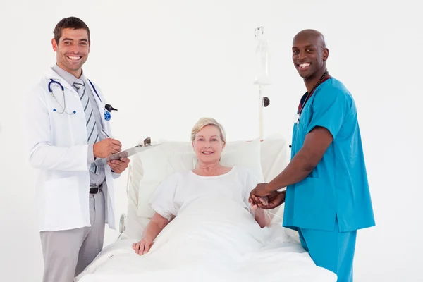 Team of doctor examining a patient — Stock Photo, Image