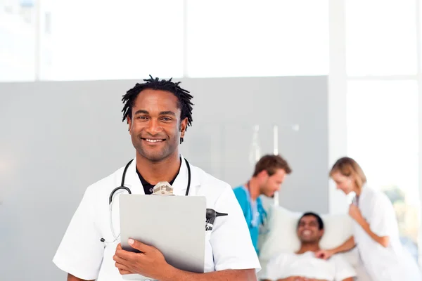 Group of doctors attending to a patient — Stock Photo, Image