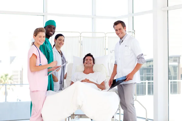 Consultation between doctors and a patient — Stock Photo, Image
