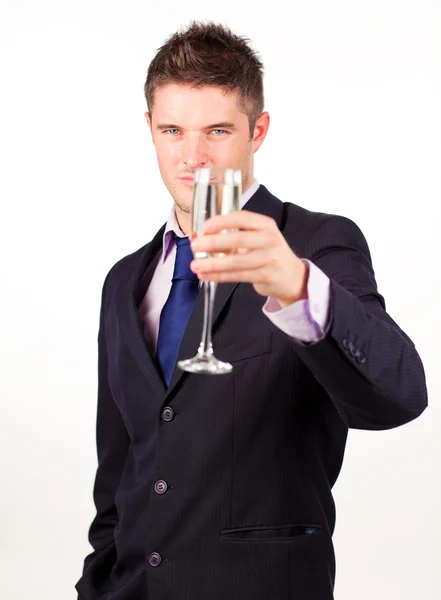Empresário segurando uma taça de champanhe — Fotografia de Stock