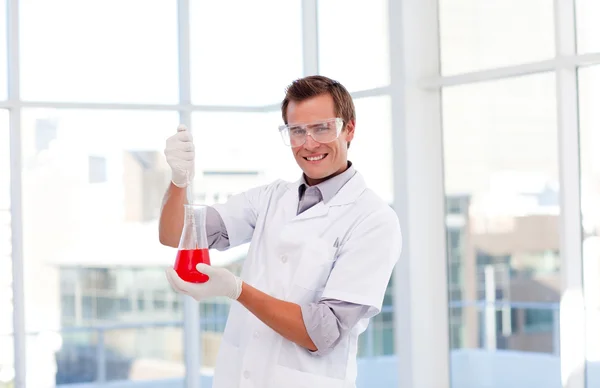 Young scientist examinig a test-tube — Stock Photo, Image