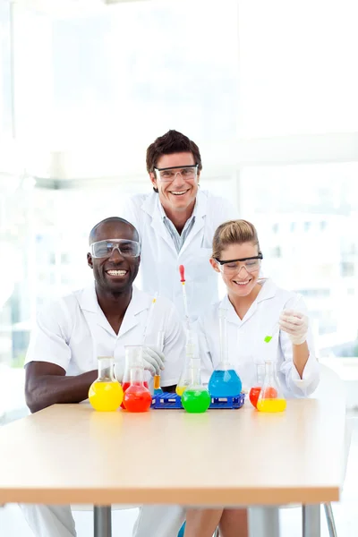 Scientists examining test-tubes with copy-space — Stock Photo, Image