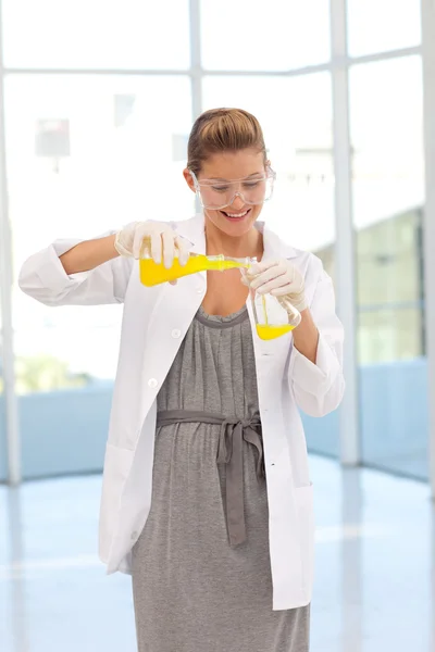 Attractive scientist examining a test-tube — Stock Photo, Image