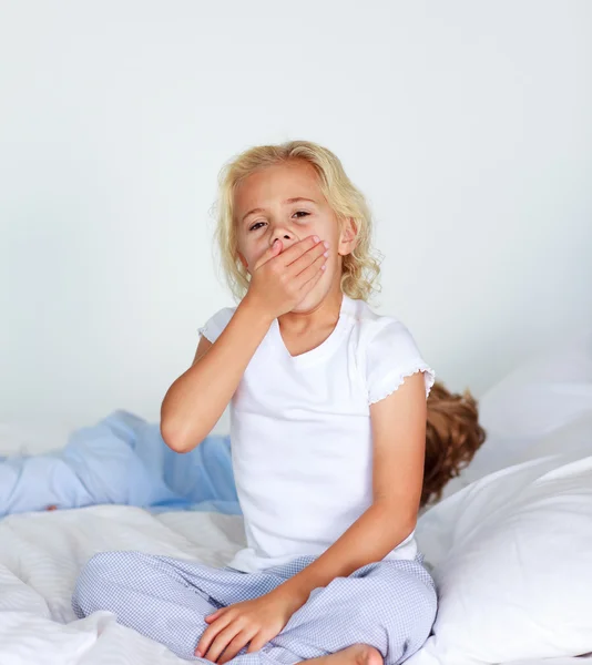 Little girl very tired in bed — Stock Photo, Image
