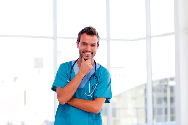 Handsome young doctor isolated in hospital — Stock Photo, Image