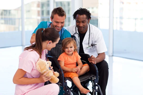 Little patient with medical team — Stock Photo, Image