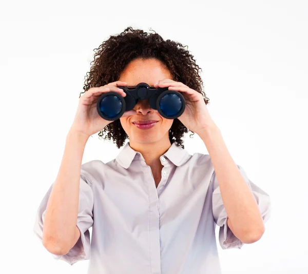 Young businesswoman searching for something with binoculars — Zdjęcie stockowe