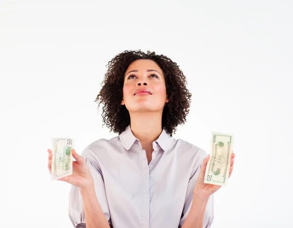 Brünette Geschäftsfrau hält Dollars in der Hand und blickt nach oben — Stockfoto