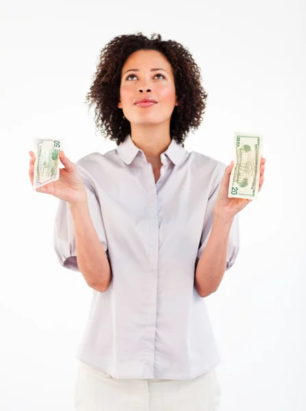 Mujer de negocios seria sosteniendo dólares y mirando hacia arriba —  Fotos de Stock