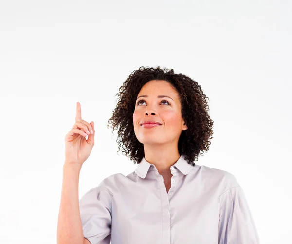 Friendly female businessmanager pointing upwards — Stock Photo, Image