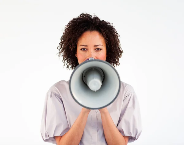Businesswoman speaking through a megaphone in front of the camera — Stock Photo, Image