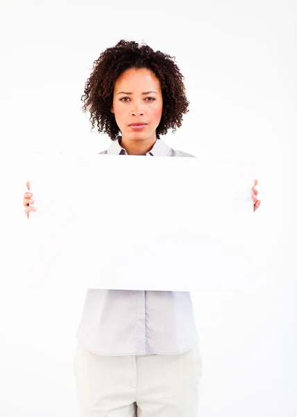 Serious businesswoman with big white card — Stock Photo, Image