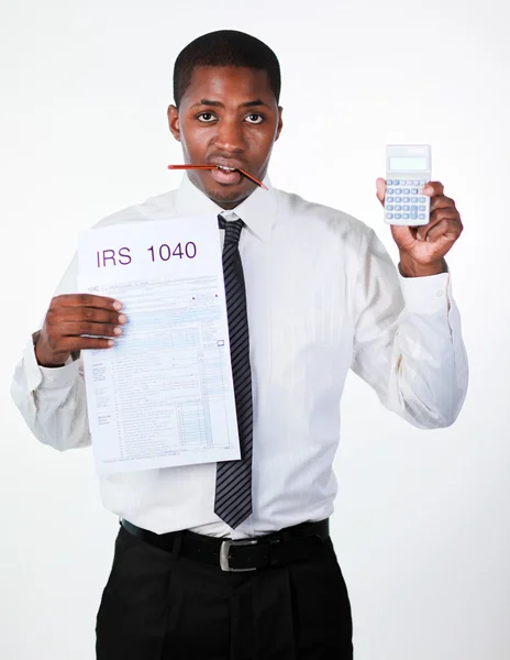 Bored businessman holding a sheet and a calculator — Stock Photo, Image