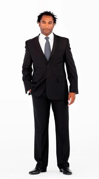Serious businessman standing in front of camera — Stock Photo, Image