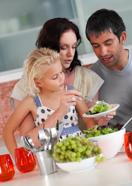 Cheerful family preparing food together — Stock Photo, Image