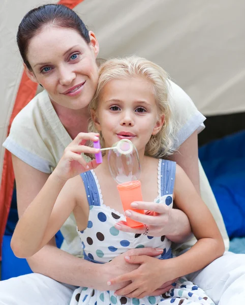 Mother and daughter having fun together in a park — Stock Photo, Image