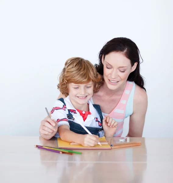 Mother and son writing together — Stock Photo, Image