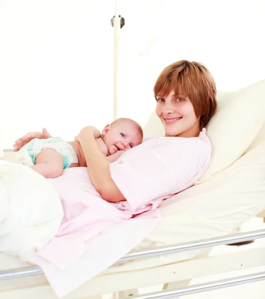 Mother holding her newborn baby — Stock Photo, Image