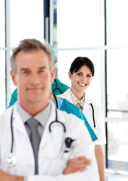 Smiling doctor in a row — Stock Photo, Image