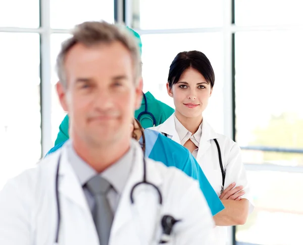 Attractive confident doctor in a line — Stock Photo, Image