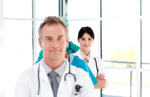 Thoughtful doctor in a row — Stock Photo, Image
