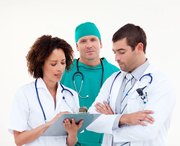 Group of attractive doctors looking at the camera — Stock Photo, Image