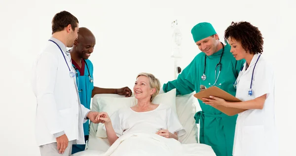 Doctors examining a patient — Stock Photo, Image