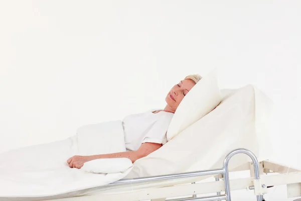 Senior patient lying on a medical bed — Stock Photo, Image