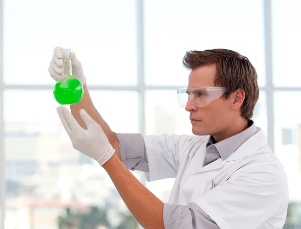 Scientist examining a test-tube — Stock Photo, Image
