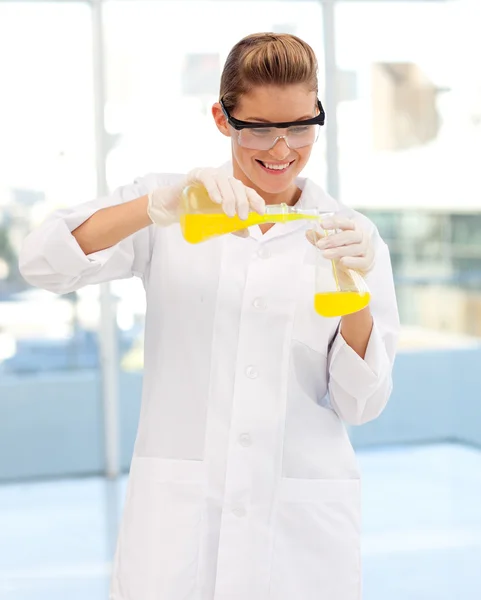 Young scientist examining a test-tube — Stock Photo, Image