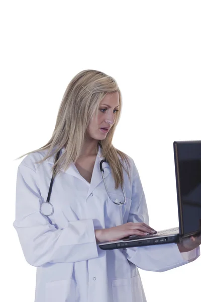 Female doctor working on a laptop — Stock Photo, Image