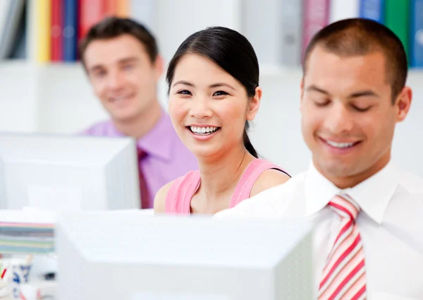 Happy business working at a computer — Stock Photo, Image